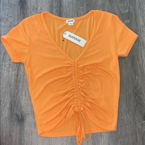 singed orange crop top